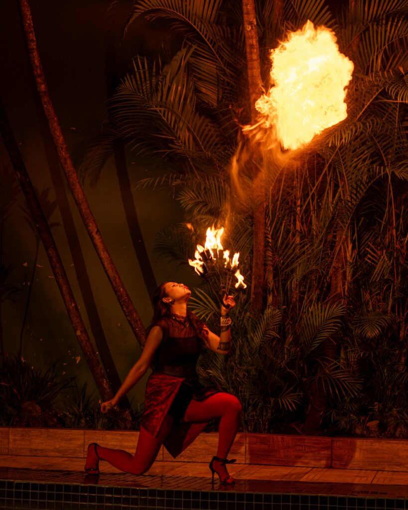 Captivating fire artist performing at night in São Paulo, Brazil. Dramatic and vibrant scene.