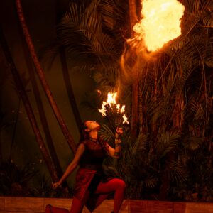 Captivating fire artist performing at night in São Paulo, Brazil. Dramatic and vibrant scene.
